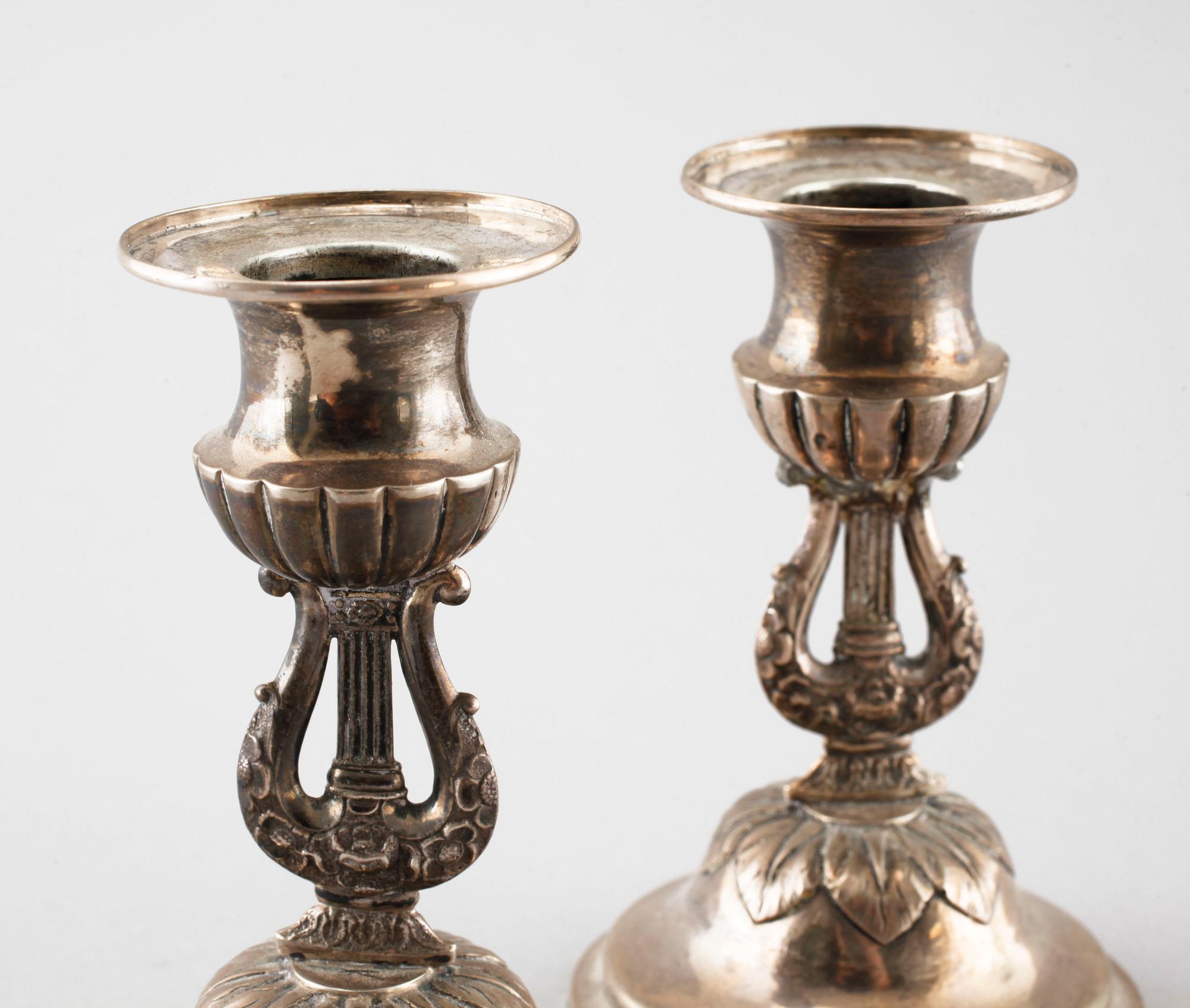 A pair of silver candelsticks by Daniel Eklund, Kalmar, empire, 1854, weight 163.