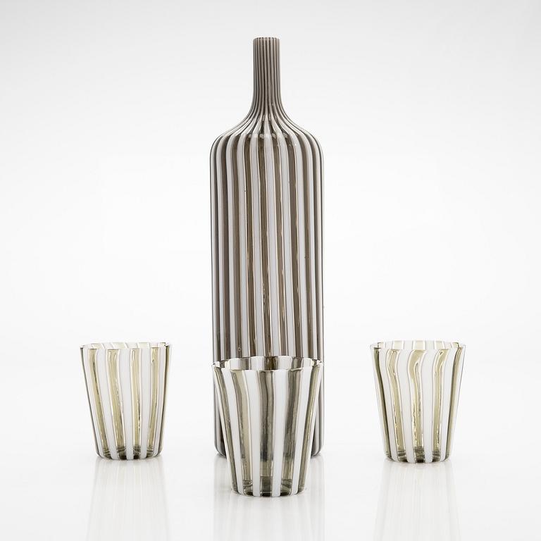 Gio Ponti, a glass bottle '4500' signed Venini, Murano and three drinking glasses, Italy.