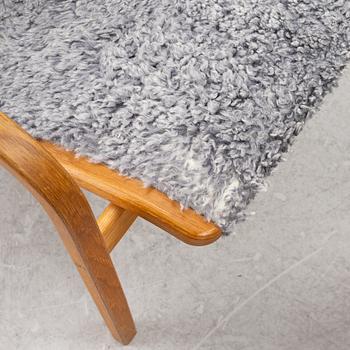 Yngve Ekström, a 'Lamino' armchair with ottoman, Swedese, Sweden, 2020's.
