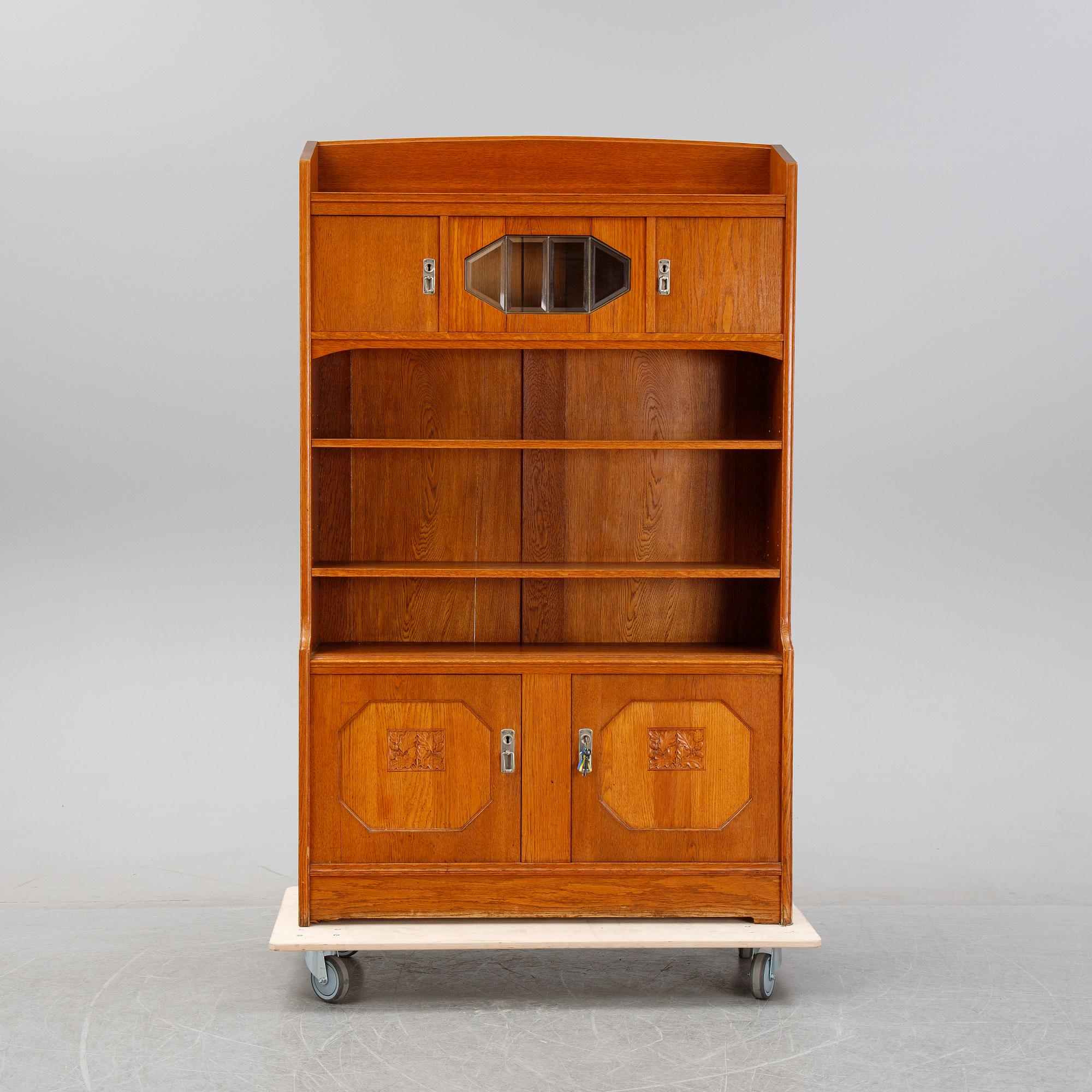 An oak cabinet and bookcase, early 20th Century.