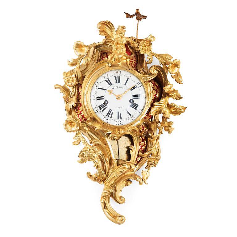 A Louis XV-style 19th century gilt bronze wall clock. Clockwork by W. M. Blakey, master in Paris 1755-74.