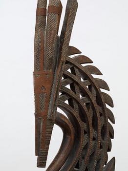 HEADDRESS. Tshiwara/Ciwara (stylized male antelope). Wooden sculpture with metal fittings.