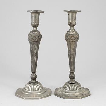 A pair of 18th century pewter candlesticks.