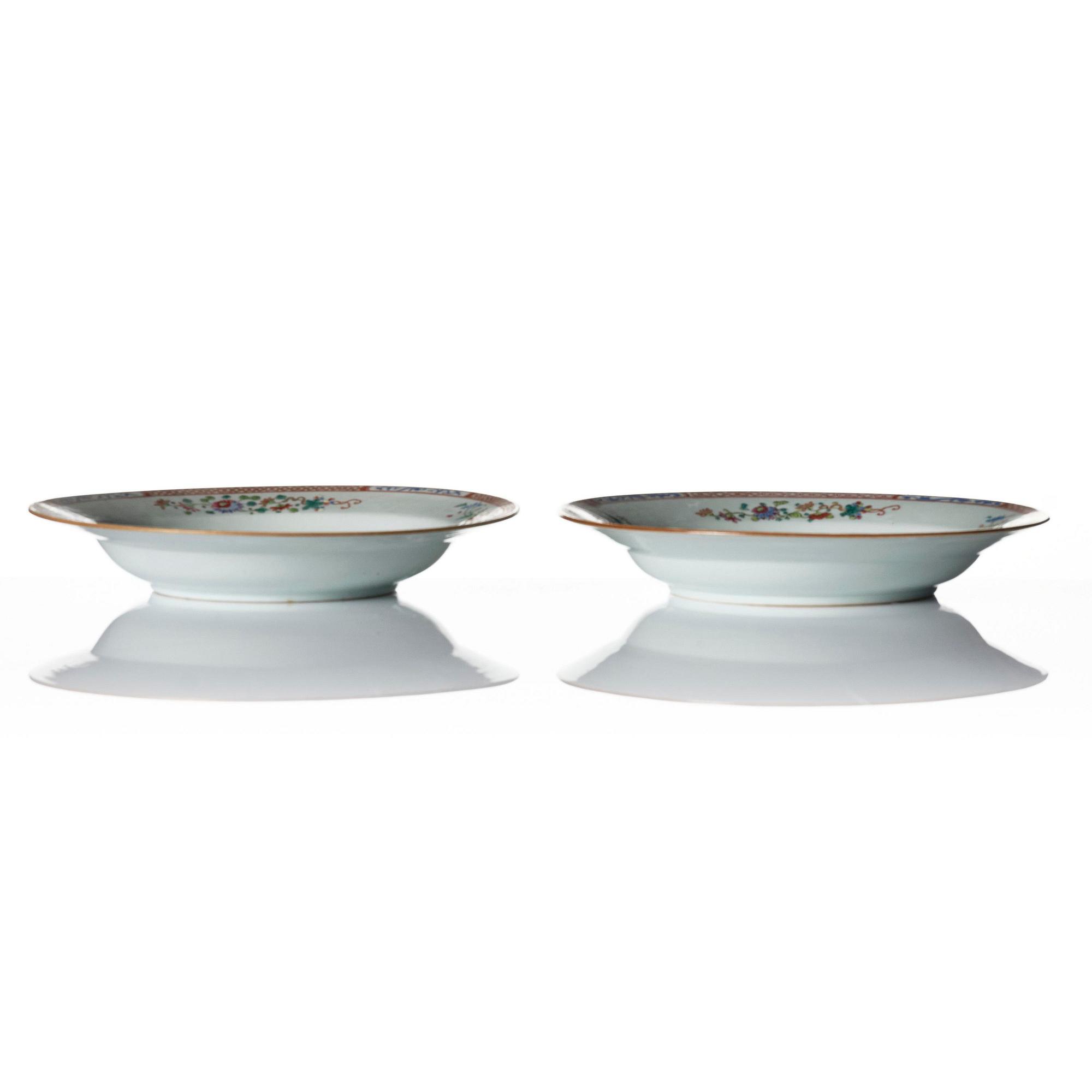 A Qianlong blue and white charger and a pair of famille rose dishes.