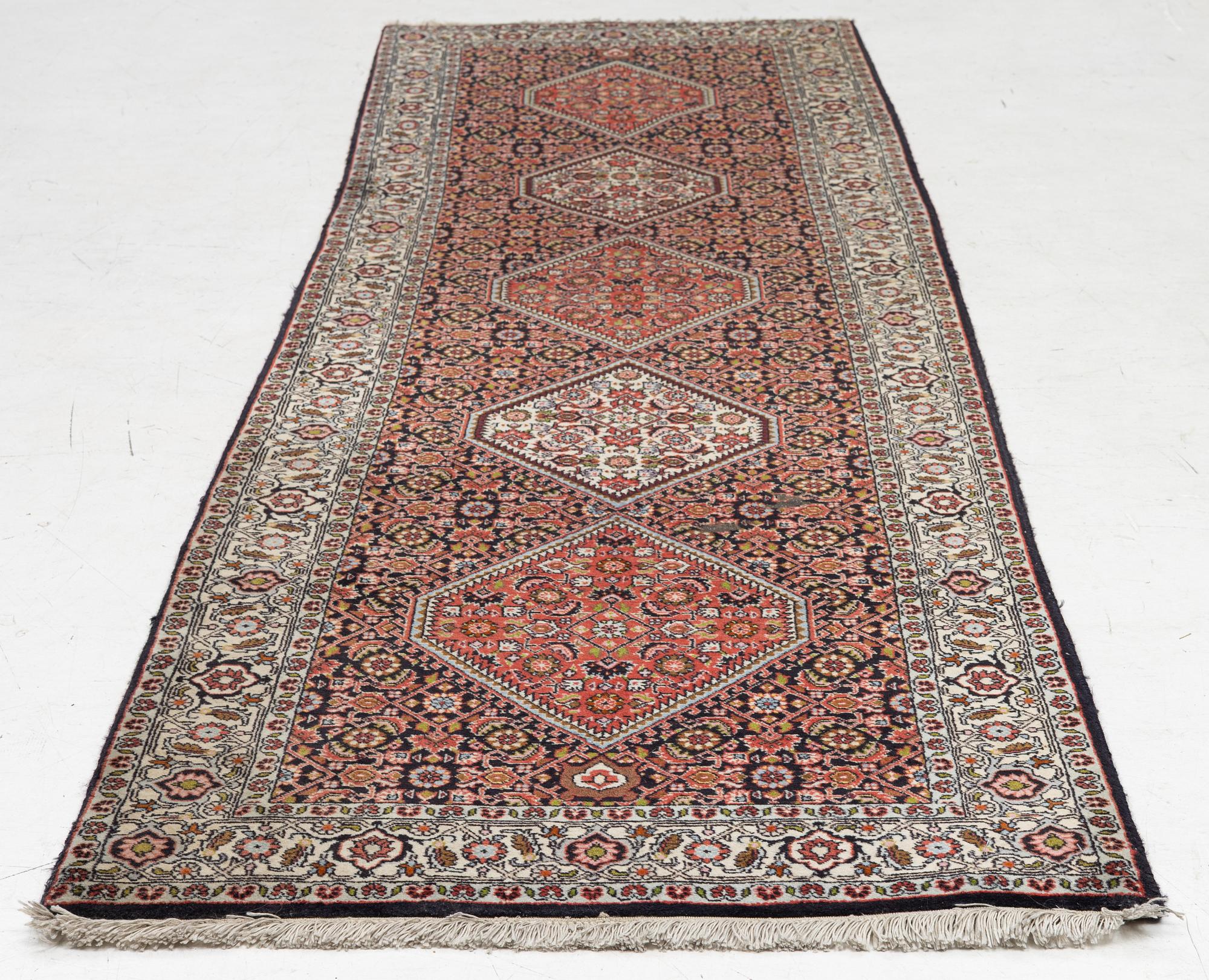 A Bidjar runner, a. 296 x 82 cm.