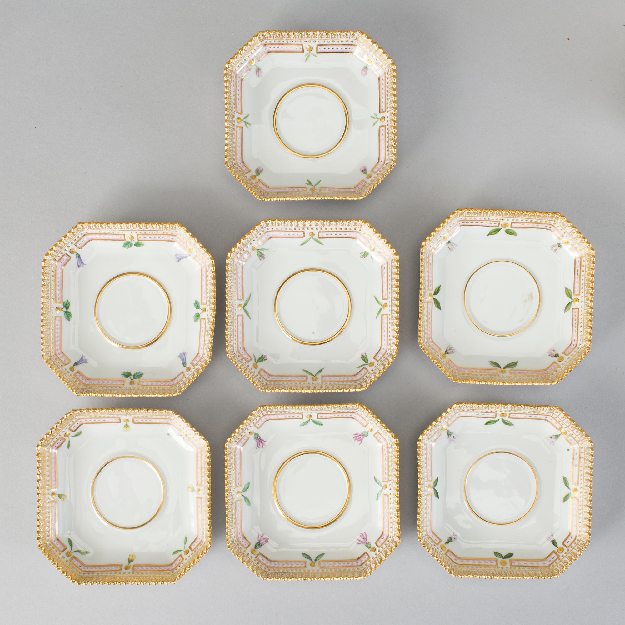 A set of seven Royal Copenhagen 'Flora Danica' custard cups with stands, 20th Century.