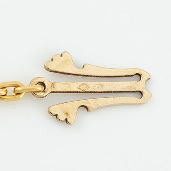 A Van Cleef & Arpels "Alhambra" necklace 18K gold with mother-of-pearl and onyx.