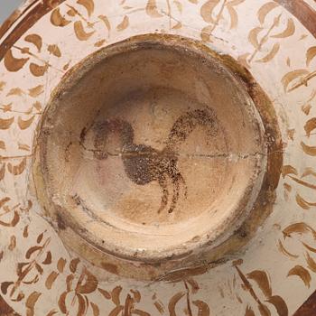 A BOWL, pottery with luster decor, height ca 10,5 cm, Persia/Iran 12th-13th century.