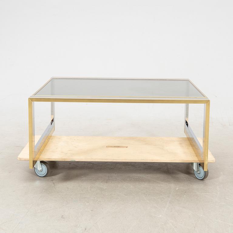 A glass and metal coffee table from Romeo Rega second half of the 20th century.