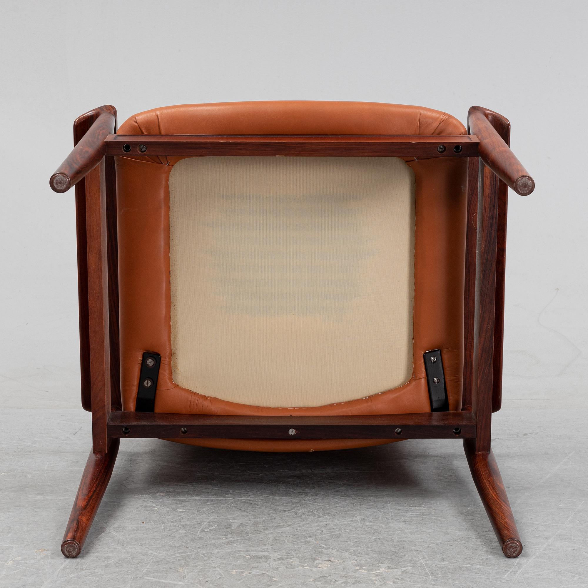 Finn Juhl, a rosewood easy chair, from Cado, Denmark, 1960's/70's.