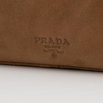 Prada, a tan suede bag.