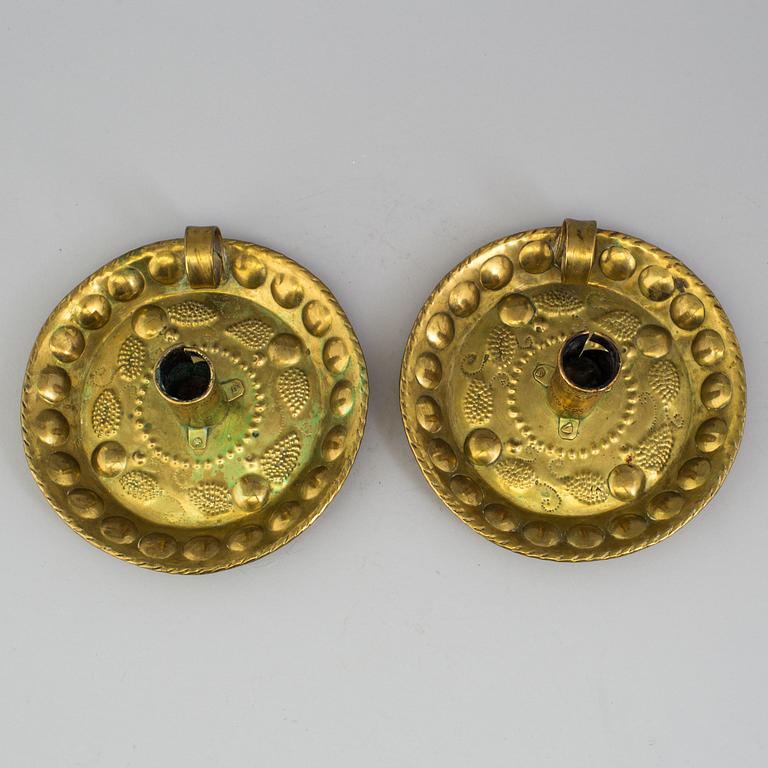 A pair of brass baroque style candlesticks.