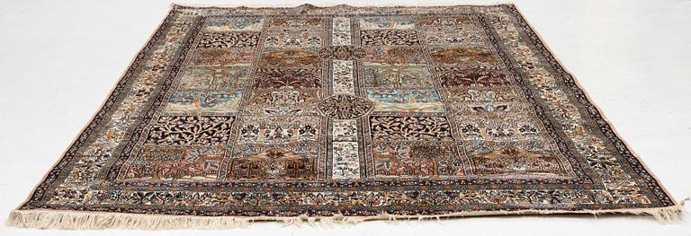 An oriental silk carpet, c. 305 x 205 cm.