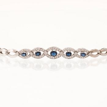 An 18K white gold bracelet set with oval faceted sapphires and brilliant-cut diamonds, Stockholm.