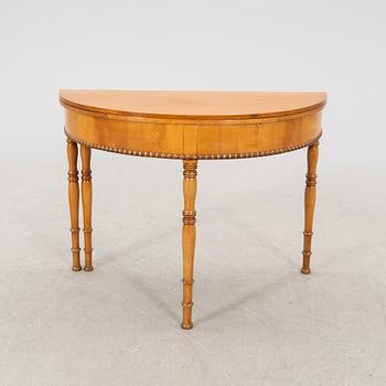 A kid 1800s late Empire birch game table.