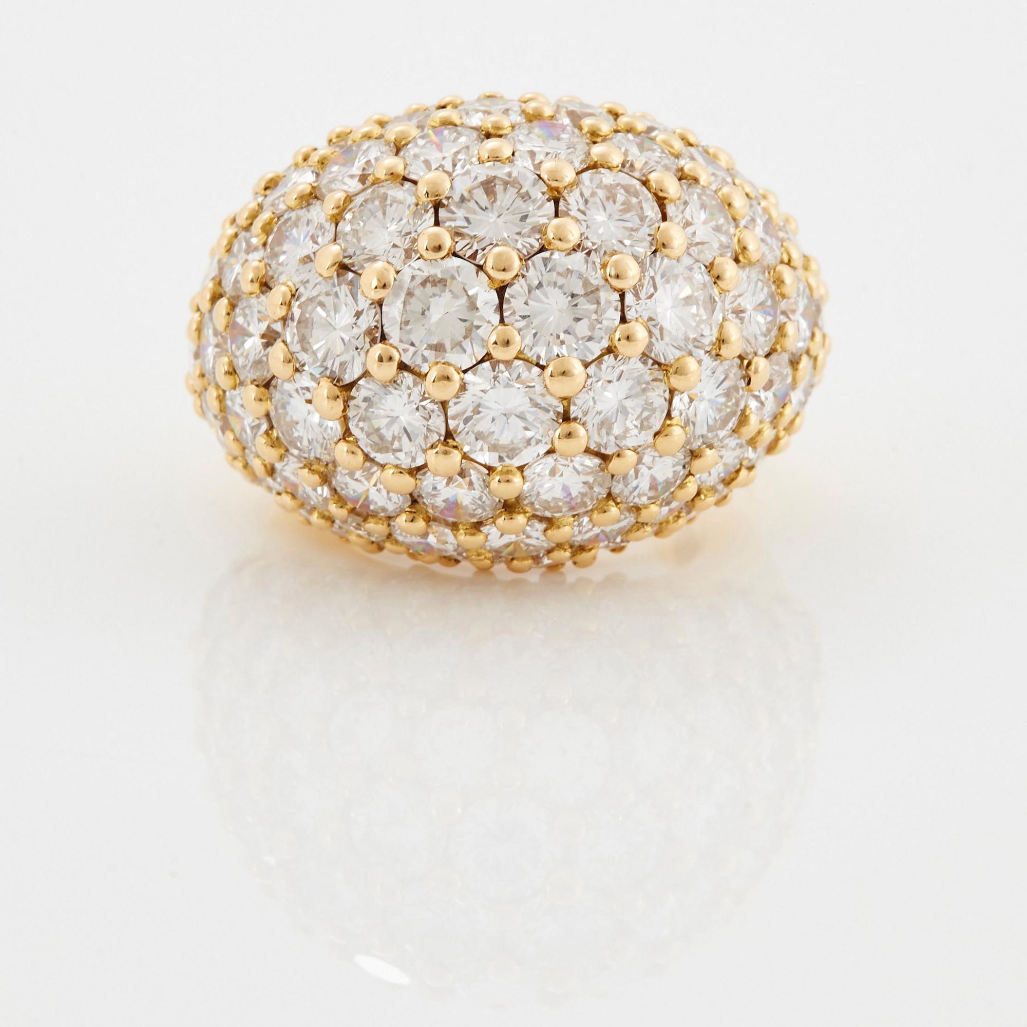 Cartier "Marrakech" an 18K gold bombé ring set with round brilliant-cut diamonds.