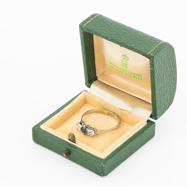 18K gold ring with two old-cut diamonds and a blue stone.