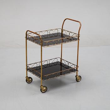 A brass and glass serving trolley, later part of the 20th Century.