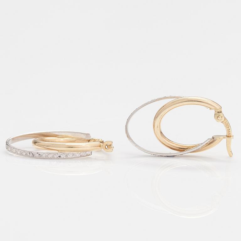 A pair of 14K gold earrings.