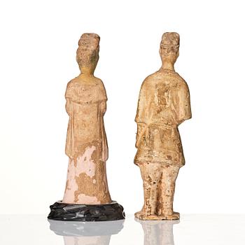 Two yellow glazed pottery figures, Tang/Sui dynasty.