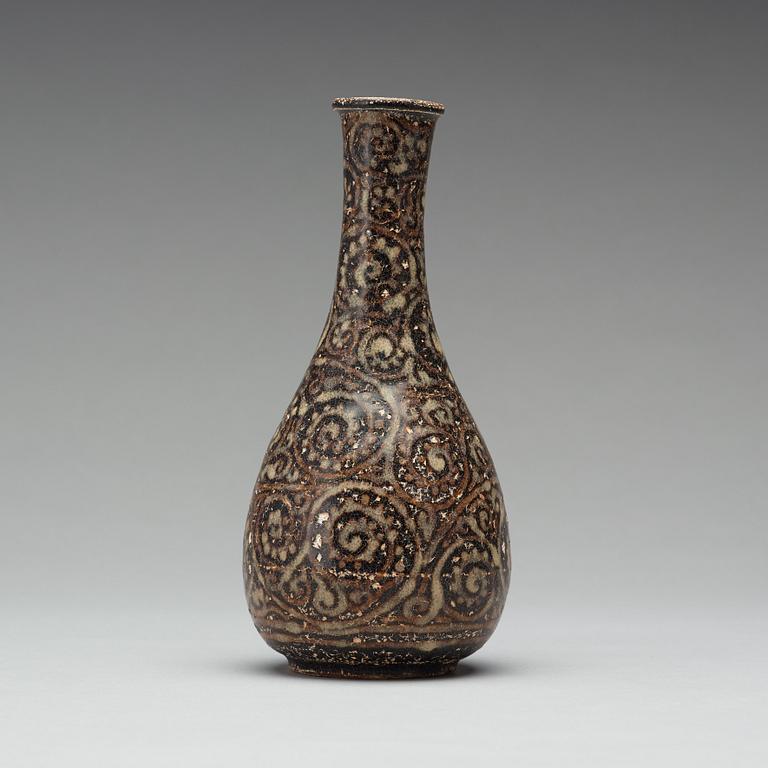 A black glazed sgrafitto vase, presumably Song dynasty (960-1279).