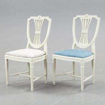 A set of a dozen white gustavian style chairs, second half of 20th century.