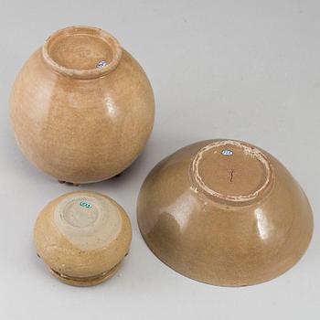 A brown glazed bowl and two pots, South East Asia, 17th Century or older.