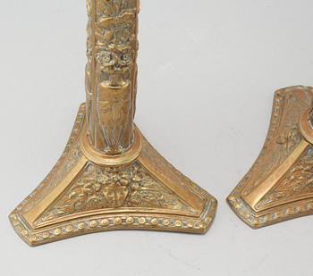 A pair of brass candlesticks from Elkingtons in Birmingham, 19th century.