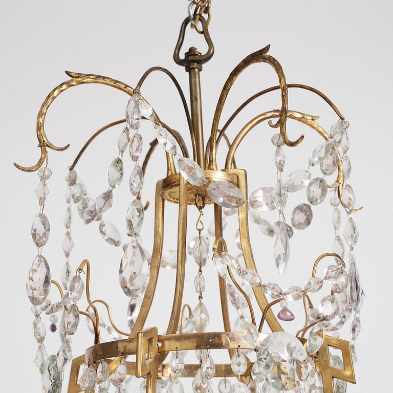 A German Louis XVI ormolu and cut-glass nine-light chandelier attributed to Johann Christoph Ermisch, late 18th century.