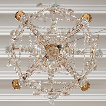 A Gustavian gilt-brass and cut-glass four-branch chandelier by O. Westerberg (master in Stockholm 1769-1881), dated 1795.