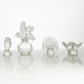 Lalique, four perfume bottles and five figurines, France, after 1945.