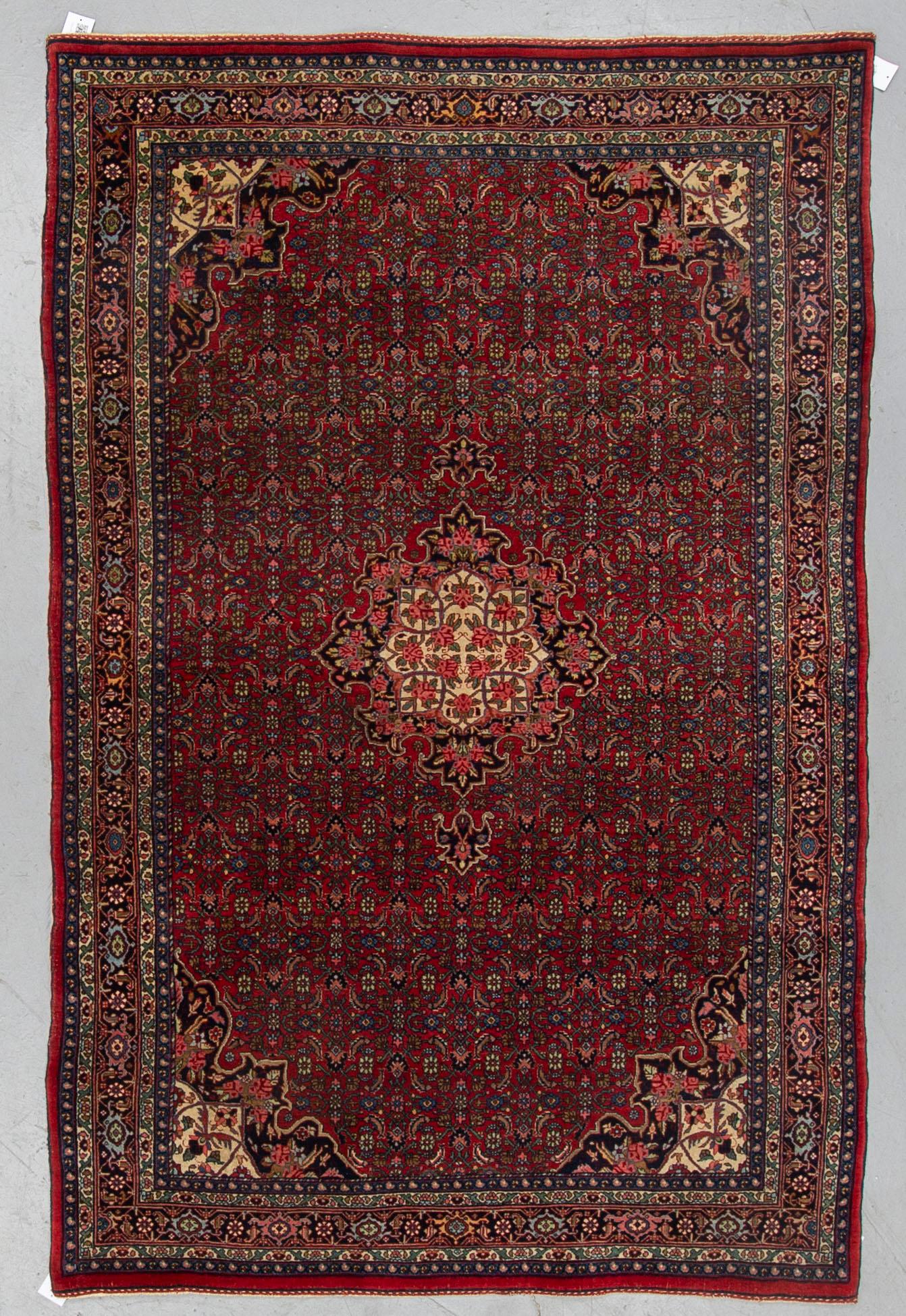 A RUG, an old Bidjar, ca 226 x 144,5-150,5 cm (as well as 1 cm flat weave at the ends).