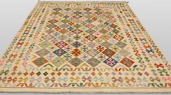 A Kilim rug, approx. 295 x 243 cm.