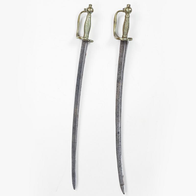 A pair of Swedish 18th Century cutlasses.