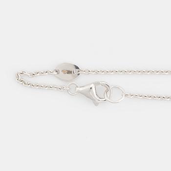 Brilliant cut diamond cross necklace.