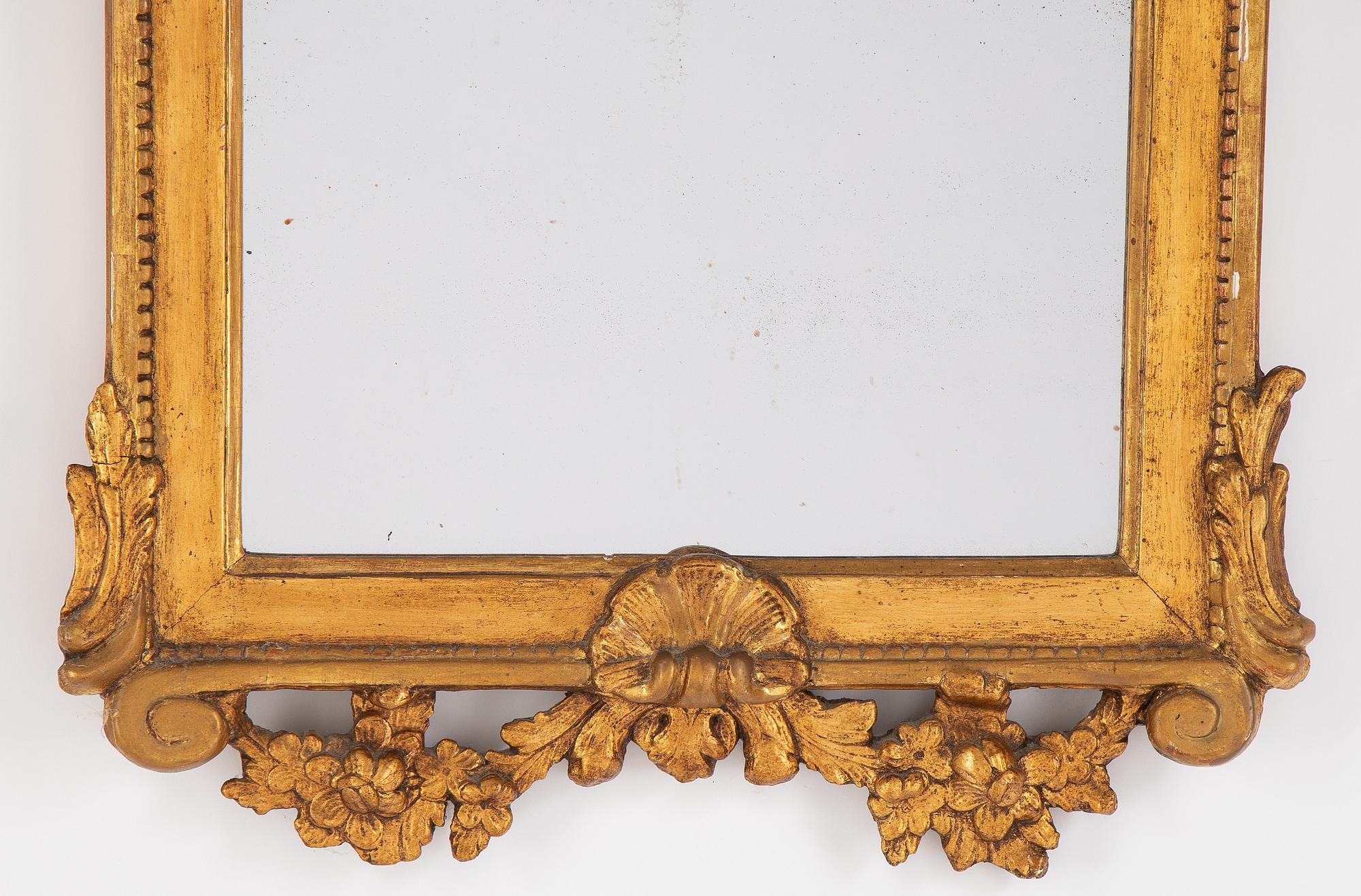 A gilt mirror, Stockholm, second half of the 18th Century.