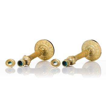 A pair of French Empire ormolu candlesticks, ca 1820's.