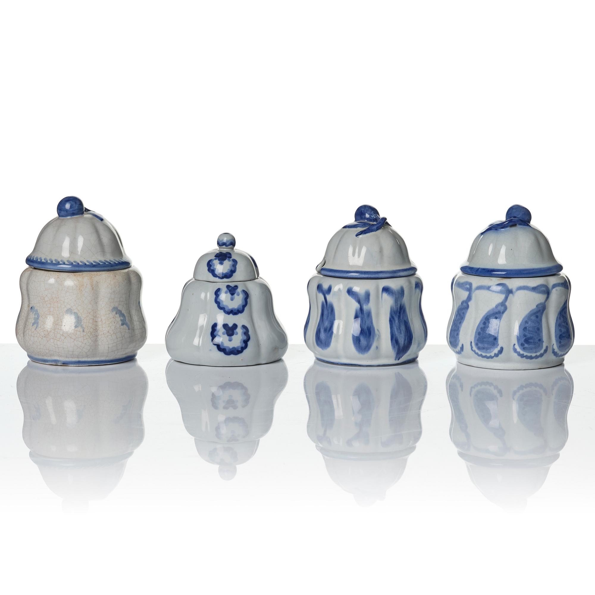 Wilhelm Kåge, eleven pieces of faience including jars, inkwells and a tulip vase, Gustavsberg, Sweden, 1919-1920.