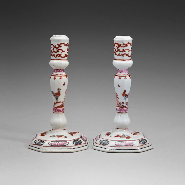 A pair of famille rose candle sticks, Qing dynasty, Qianlong (1736-95).