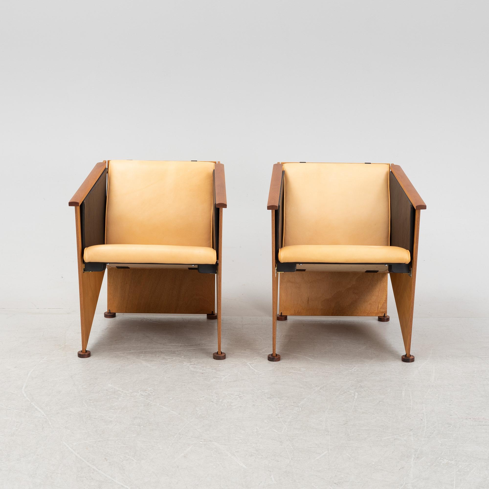 Torbjörn Ahlström, a pair of mahogany and cherry armchairs.