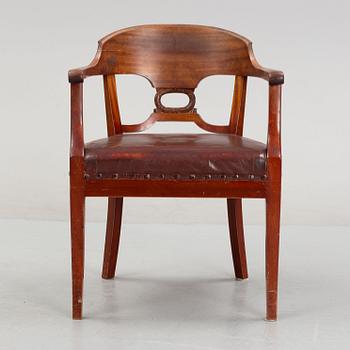 An Empire style writing desk, first half of/mid 20th century, and an Empire style chair, early 20th century.