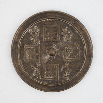 A Chinese bronze mirror, China, late Qing dynasty.