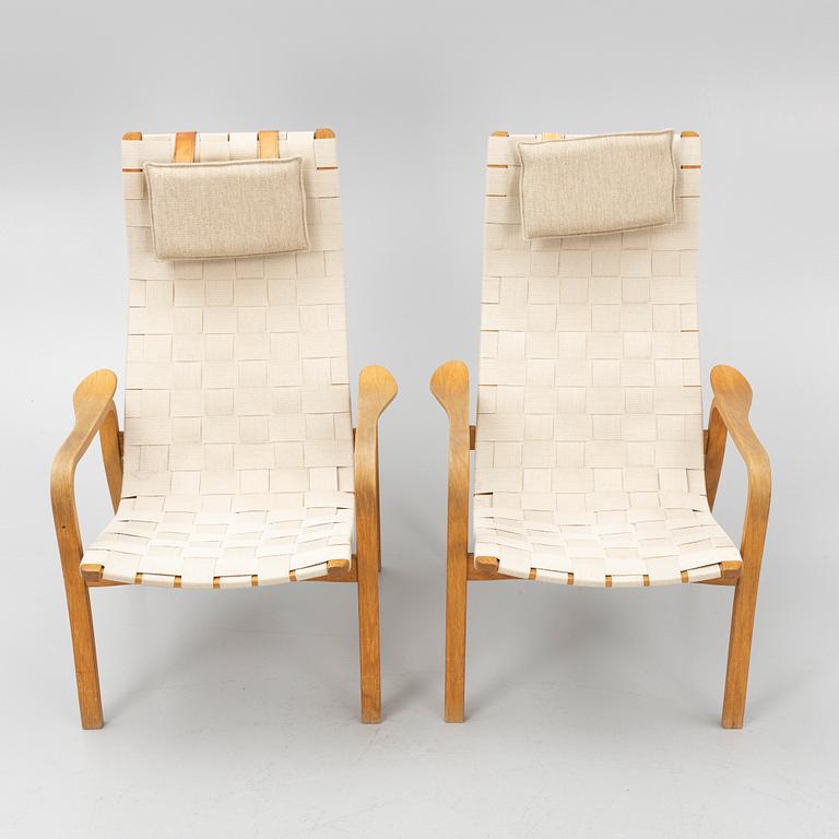 Yngve Ekström, a pair of "Primo" armchairs with ottomans, Swedese, Sweden,