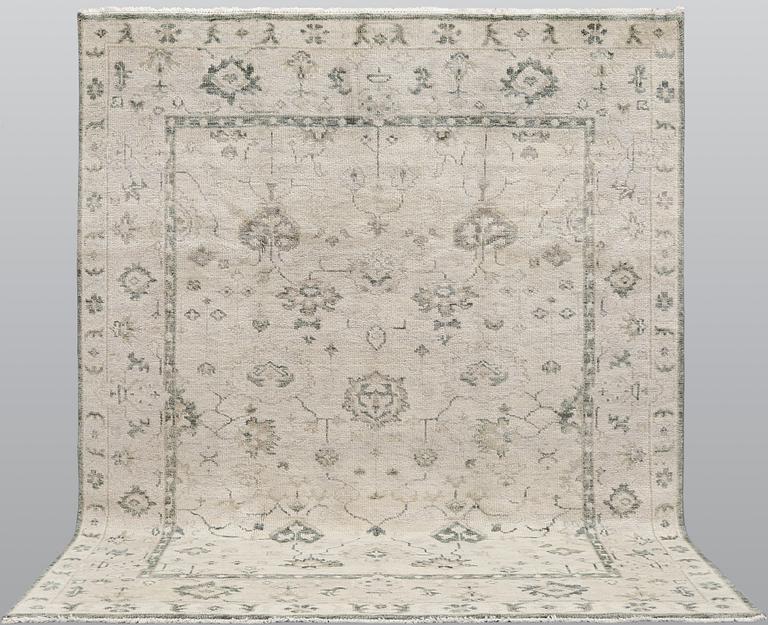 An oriental carpet,  ca 304 x 248 cm.