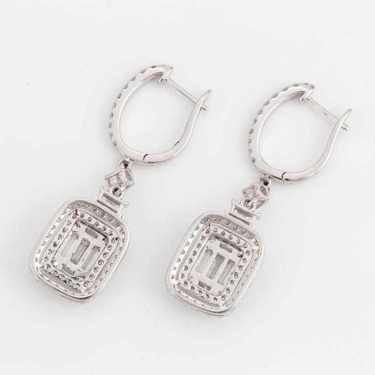 A pair of baguette and brilliant-cut diamond earrings.