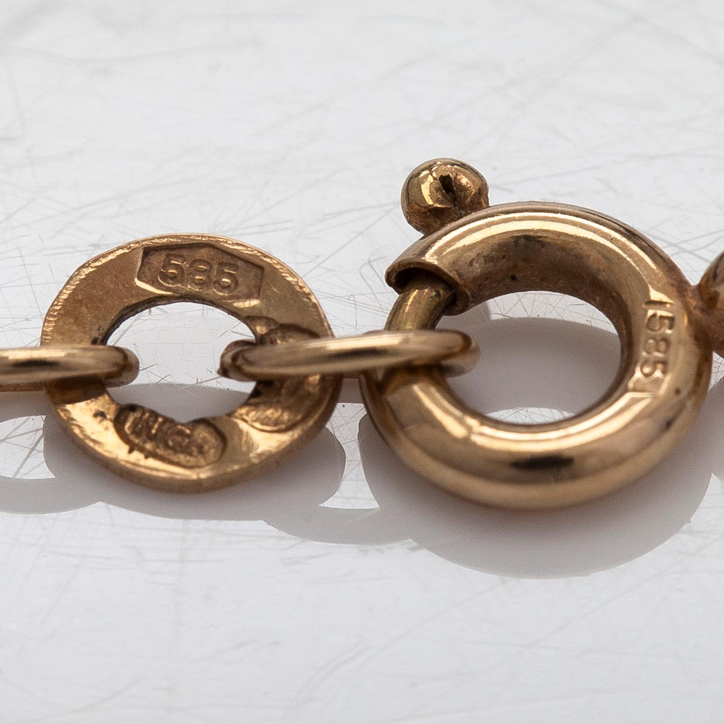 Kaulakoru, 14K kultaa, cabochonhiottu kuukvartsi ja ametisti. Suomalaiset leimat.