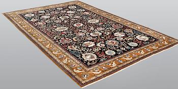 A silk Ghom carpet, 309 x 200 cm.