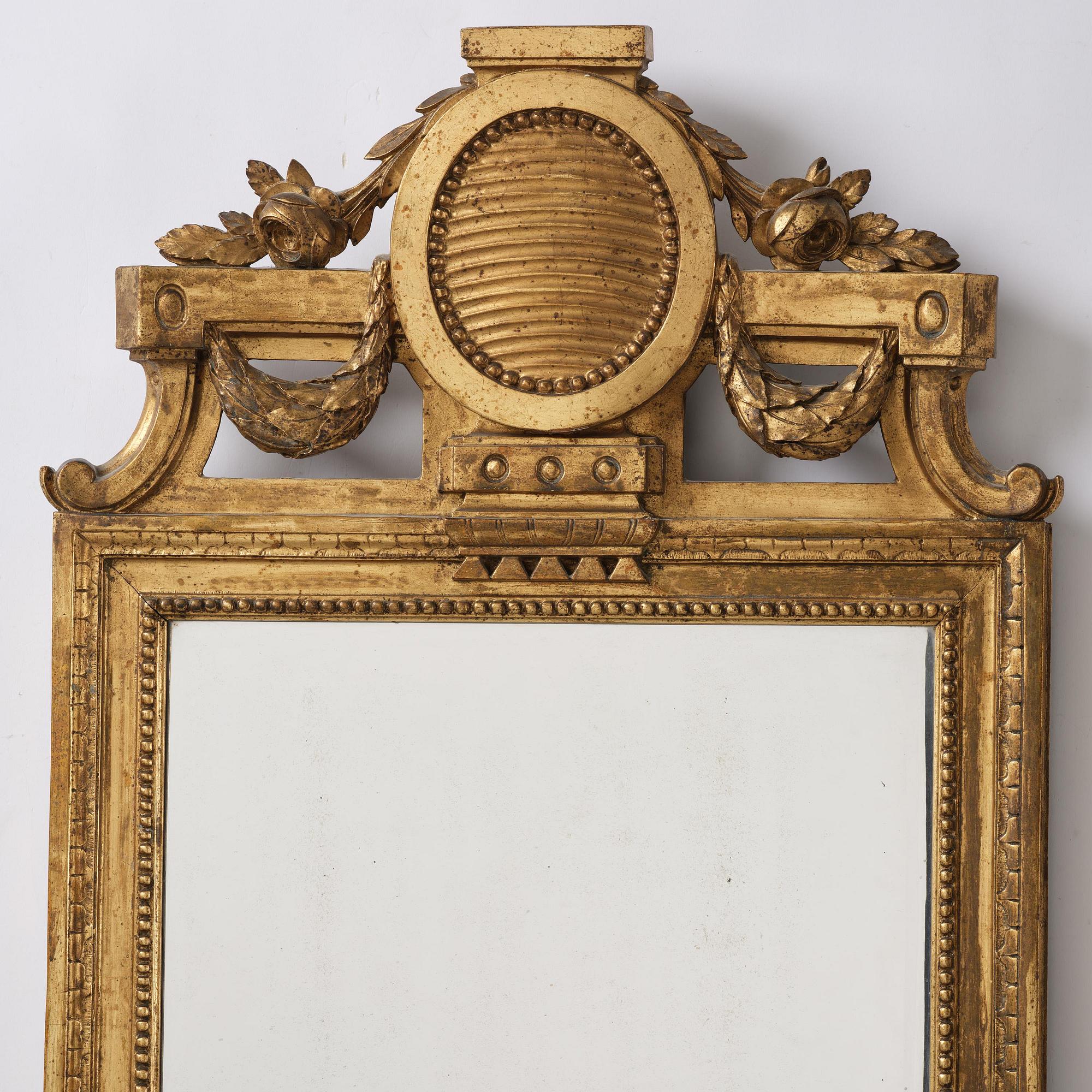 A Gustavian giltwood mirror by J. Åkerblad (master in Stockholm 1758-99).