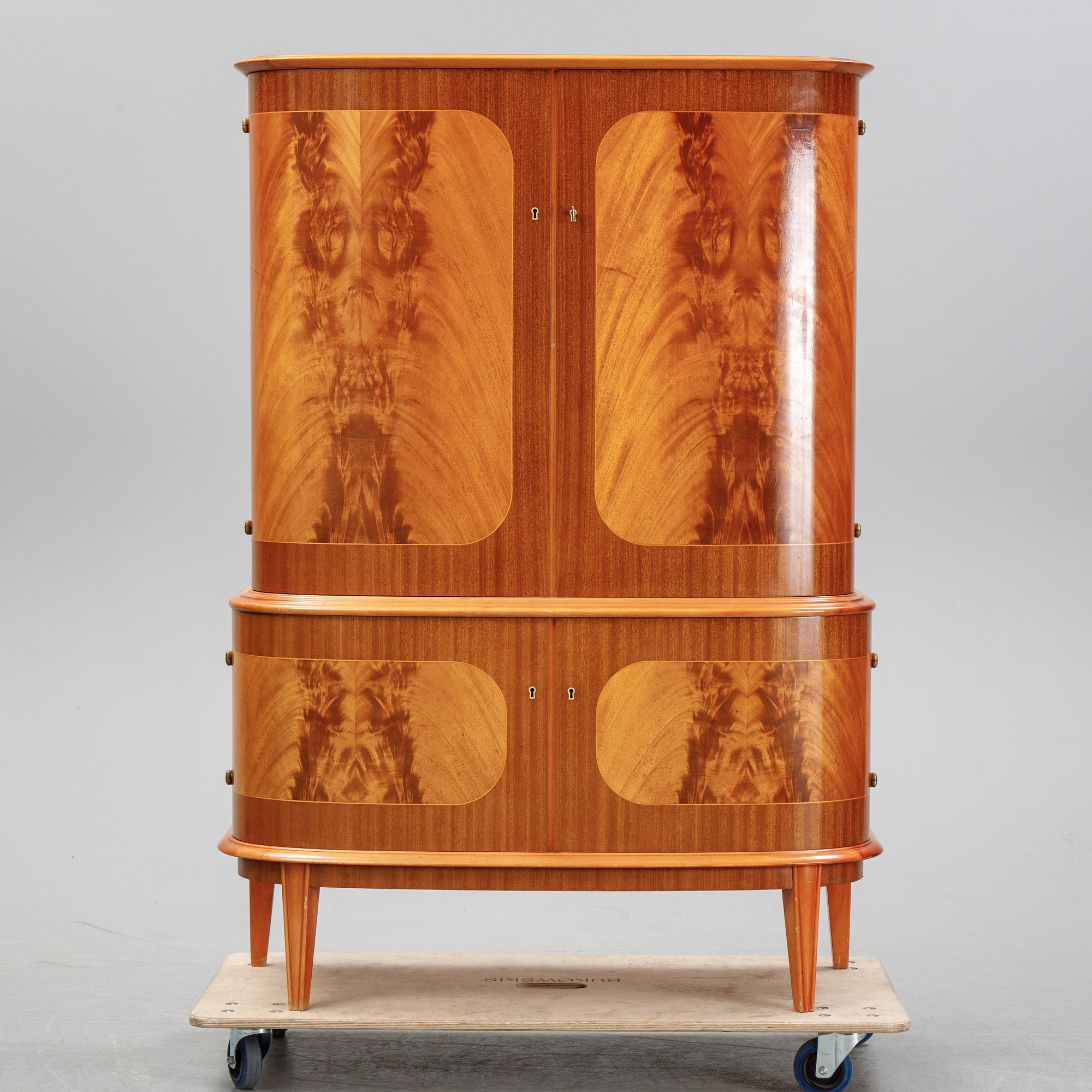 A mahogany veneered cabinet, mid 20th Century.