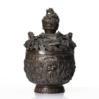 A bronze reticulated incense burner with cover, Qing dynasty (1644-1912).